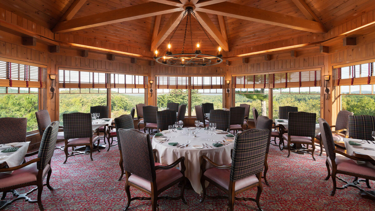 Lake Winnipesaukee Golf Club main dining room overlooking the golf course and a view of Lake Winnipesaukee.