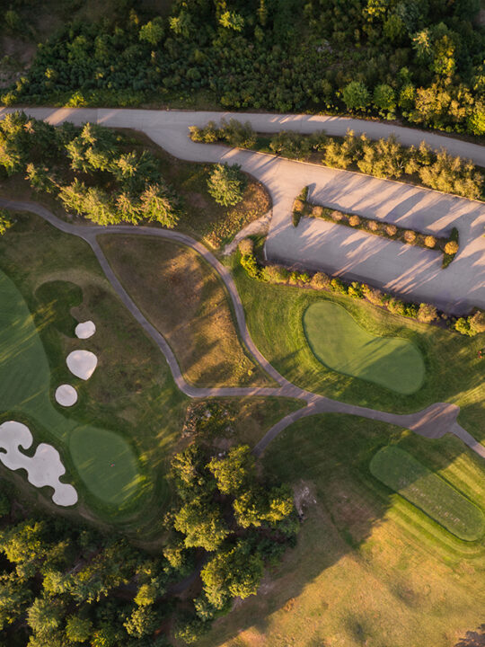 Aerial view of the The Club House and golf course at Lake Winnipesaukee Golf Club.