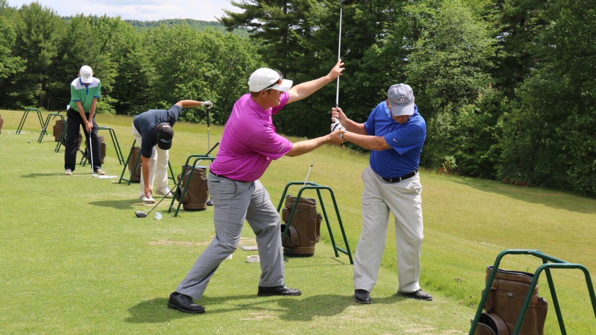 Jason Sedan - golf professional at Lake Winnipesaukee Golf Club teaching on the range.